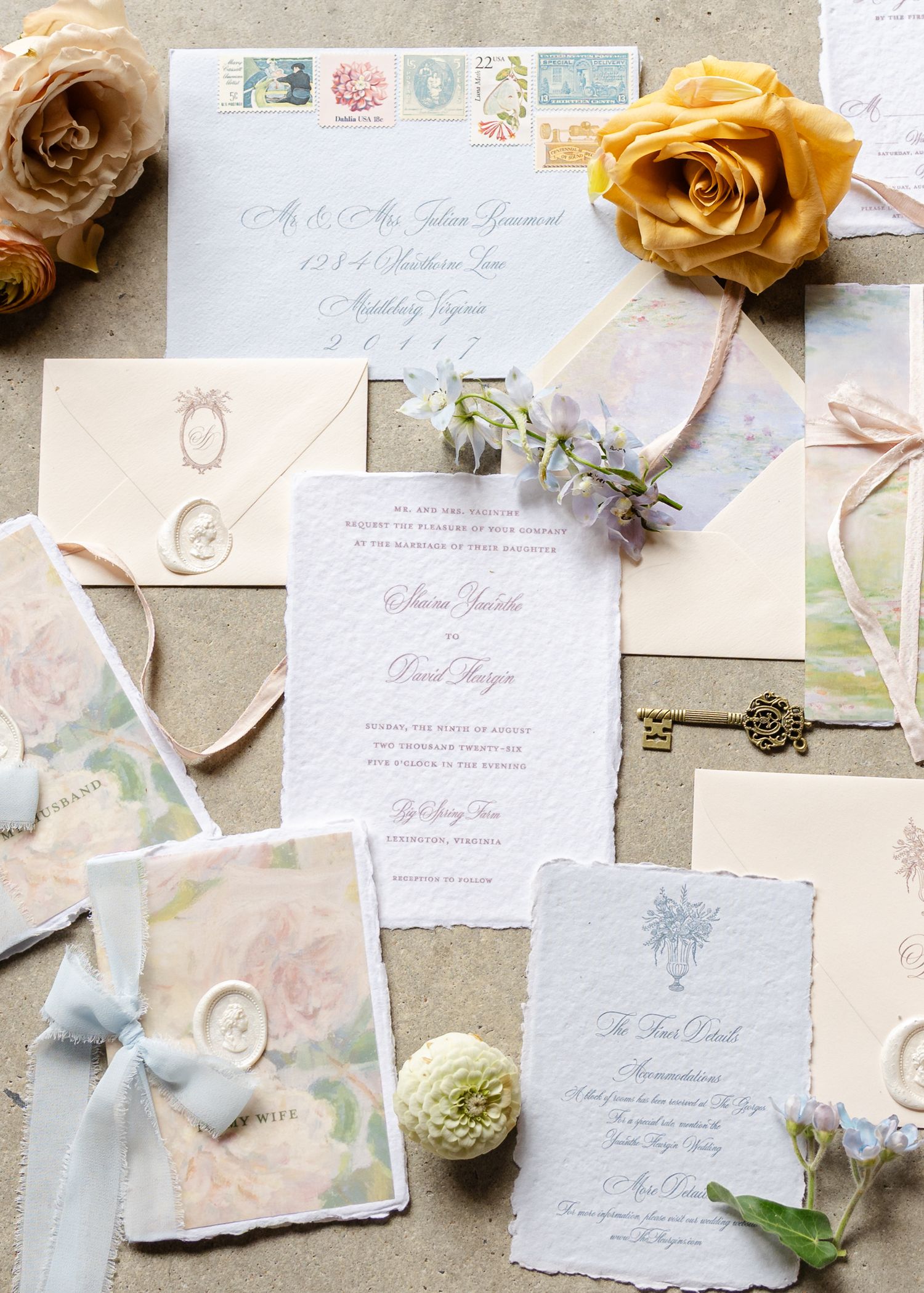 Elegant wedding stationery suite with watercolor elements, wax seals, vintage stamps, and yellow roses flatlay.
