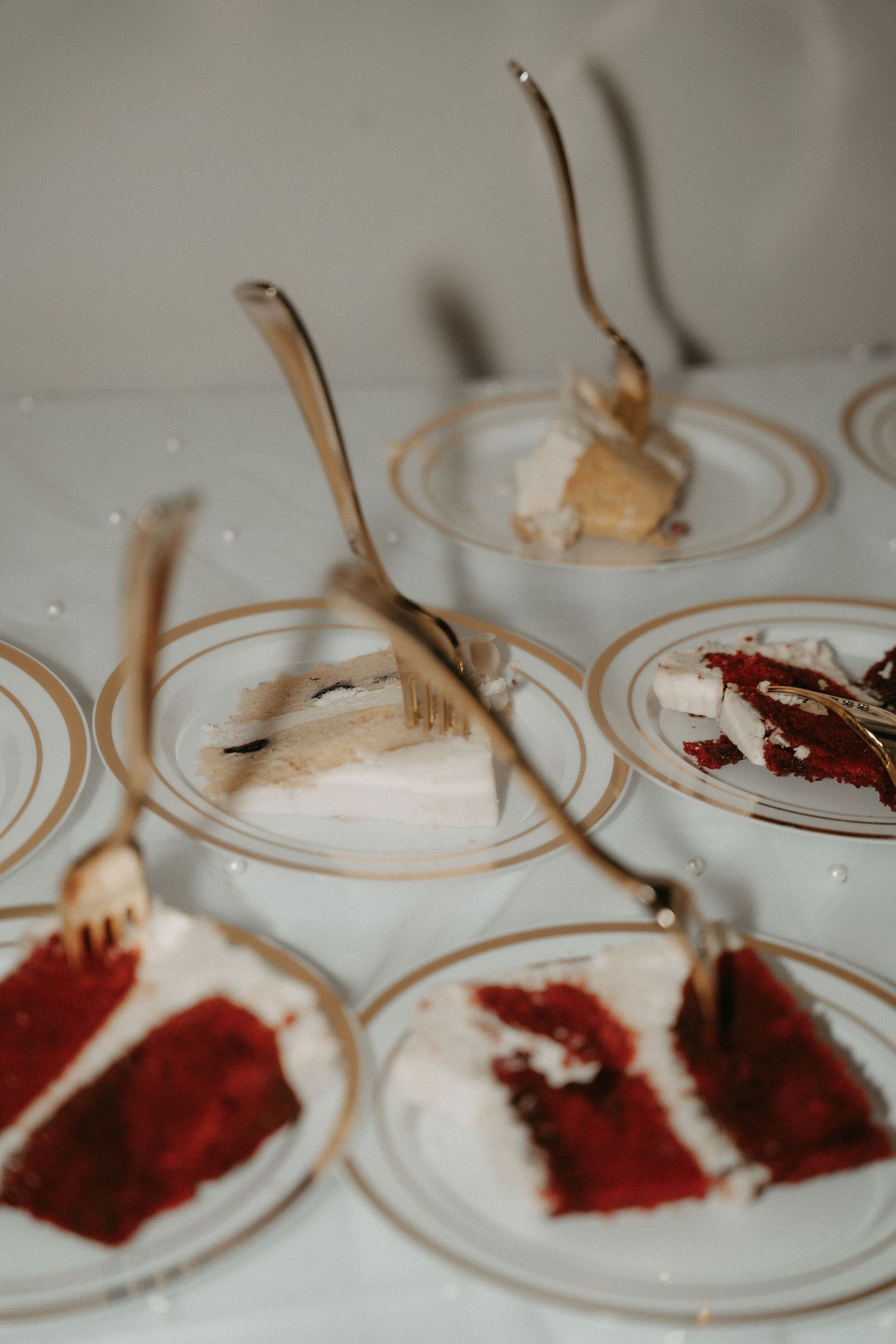 A series of plates showing red and brown spices being mixed together in circular motions for flavor testing.