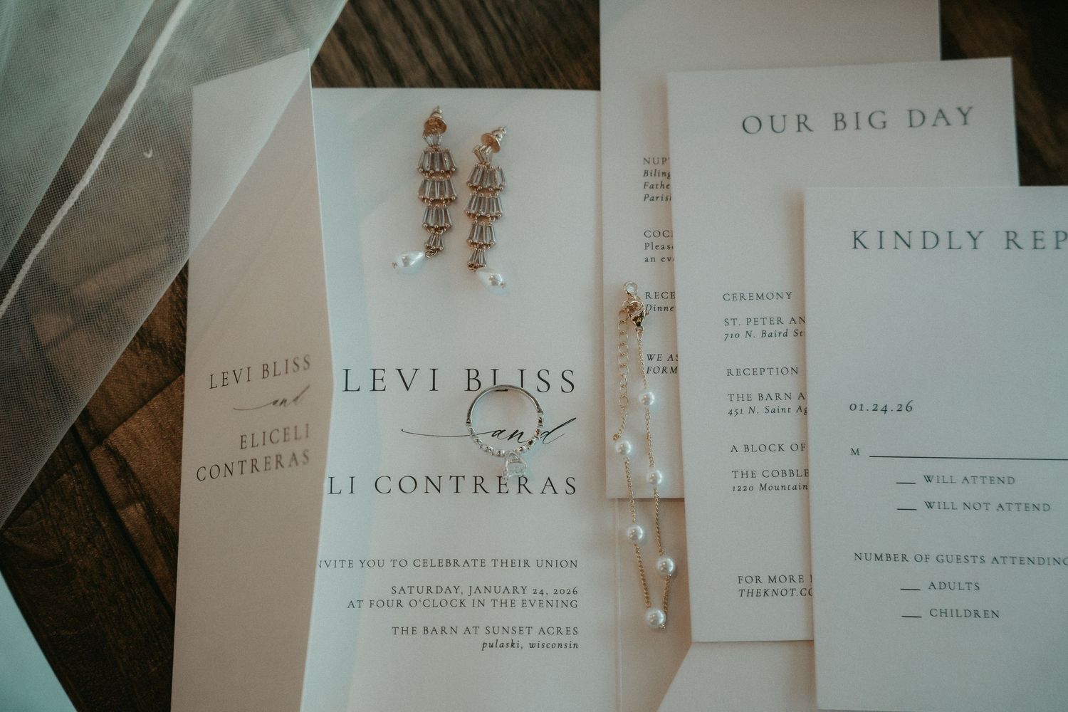 Elegant minimalist wedding invitation suite featuring soft beige and white stationery with delicate typography.