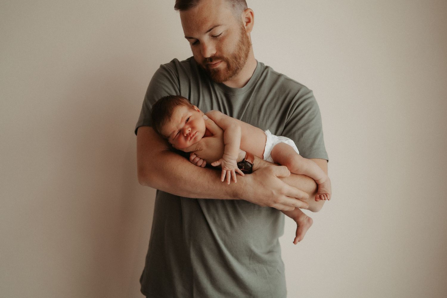 dad holding newborn