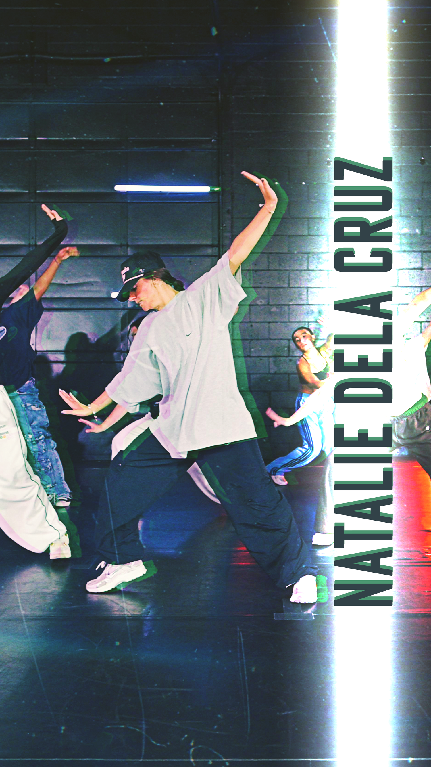 Dynamic dancers perform energetic hip-hop moves in a dimly lit studio with neon lighting effects.