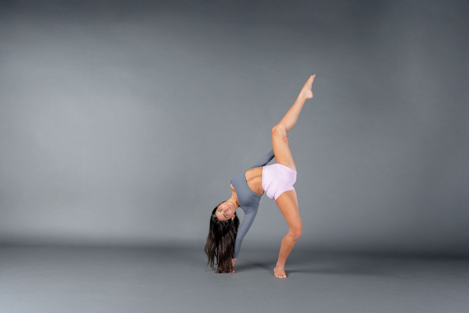 A sequence of dynamic dance movements captured in multiple frames showing a performer in flowing motion.