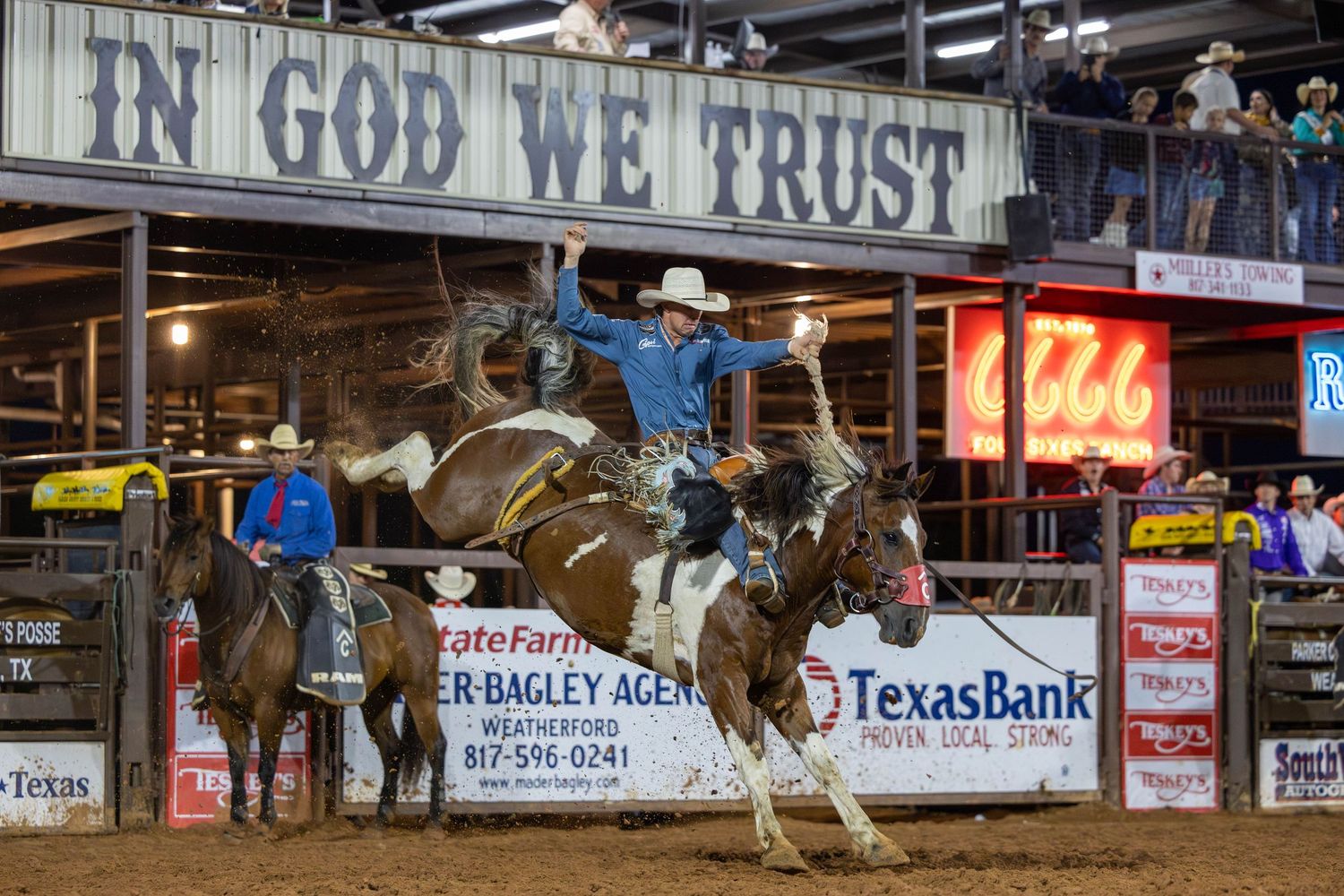 Bull riders compete in a dramatic rodeo sequence showing multiple attempts at professional bull riding in an indoor arena.