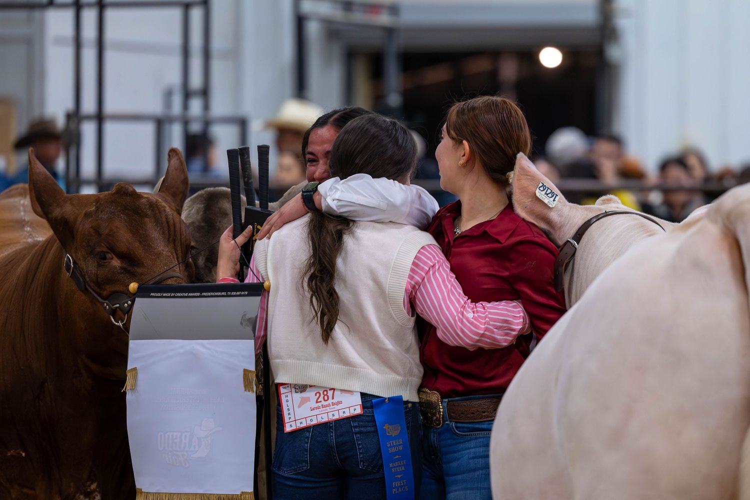 Competitors gathered around their animals during a livestock show event.