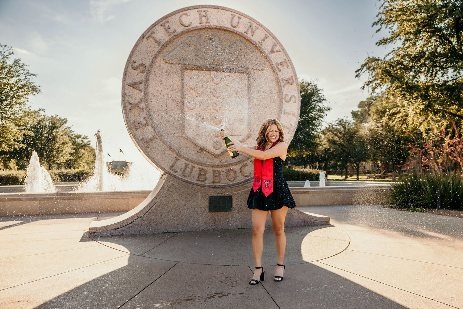 A series of photos showing different poses in front of a circular Virginia Tech University seal on a concrete wall.