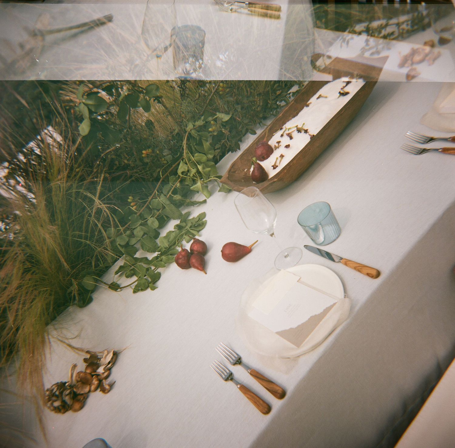 Vintage film photo collage showing table settings and decor details at a wedding reception.