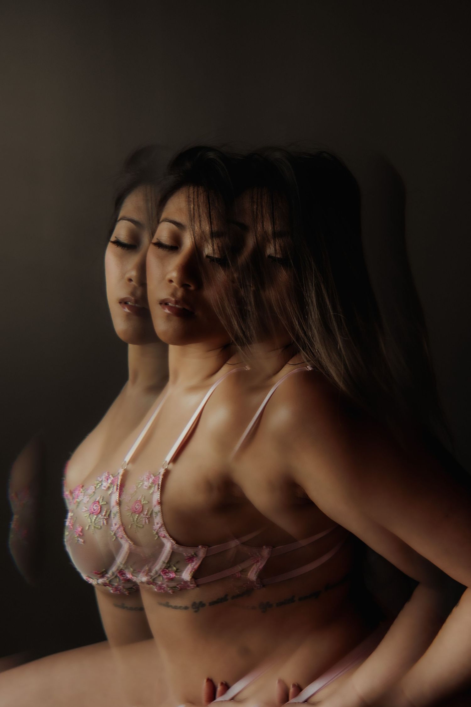 Inclusive boudoir photography session in Grand Rapids featuring a confident woman in a body-positive studio environment