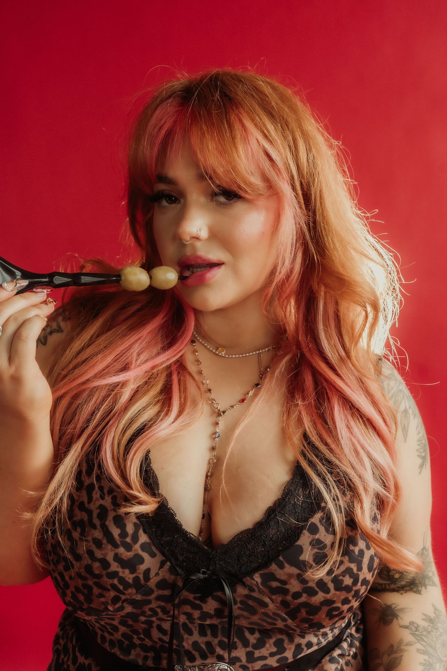 Inclusive boudoir photography session in Grand Rapids featuring a confident woman in a body-positive studio environment