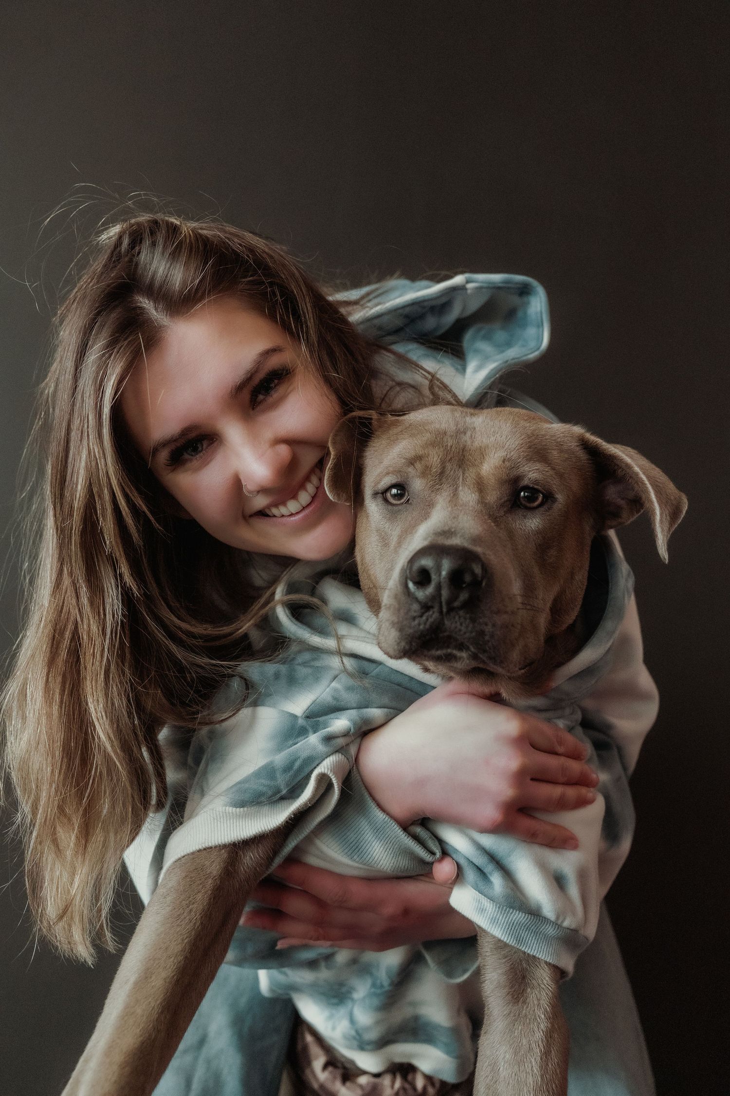 Inclusive boudoir photography session in Grand Rapids featuring a confident woman in a body-positive studio environment