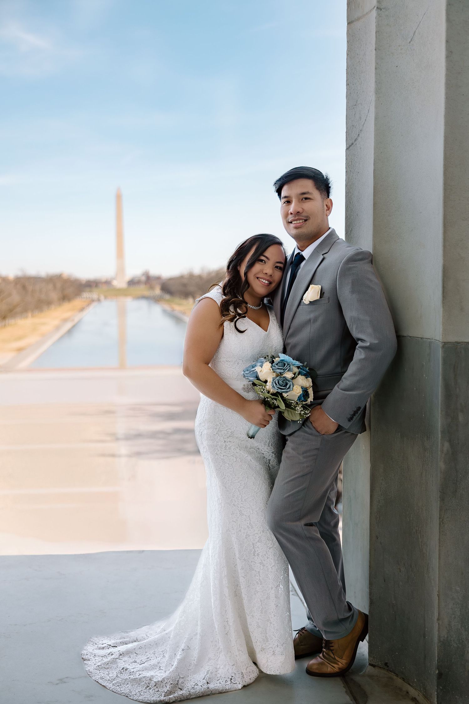 Bride and groom sharing a quiet moment by the Reflecting Pool during their DC elopement