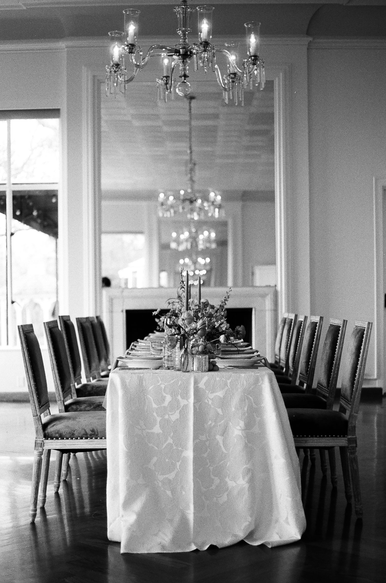 Candid reception moment shot on 35mm film with authentic lighting and texture
