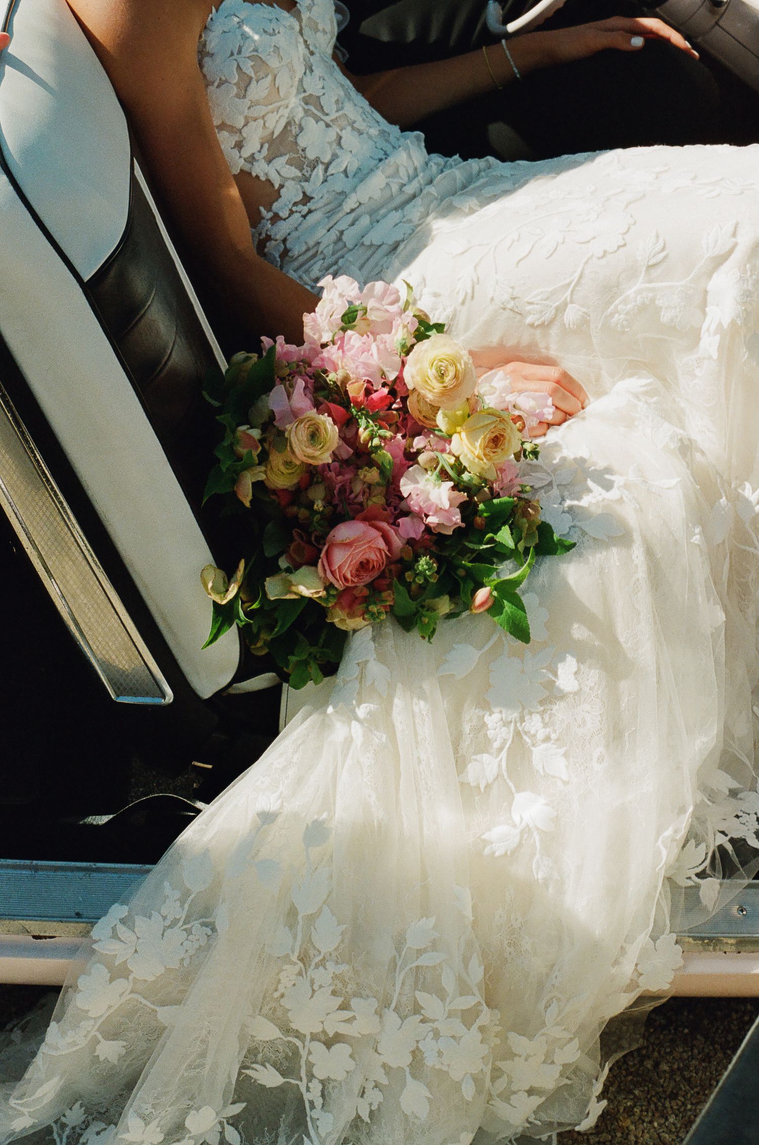 35mm film photo of bride’s wedding bouquet with soft grain and natural colors