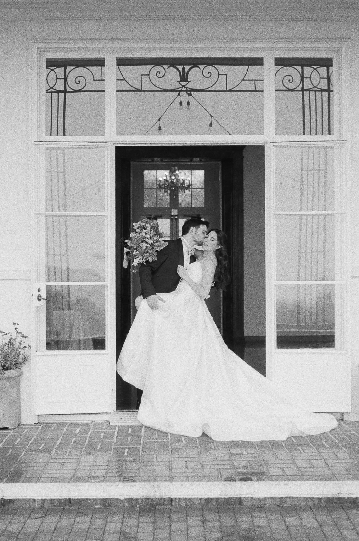 Editorial-style bridal shoes photographed on 35mm film with soft shadows