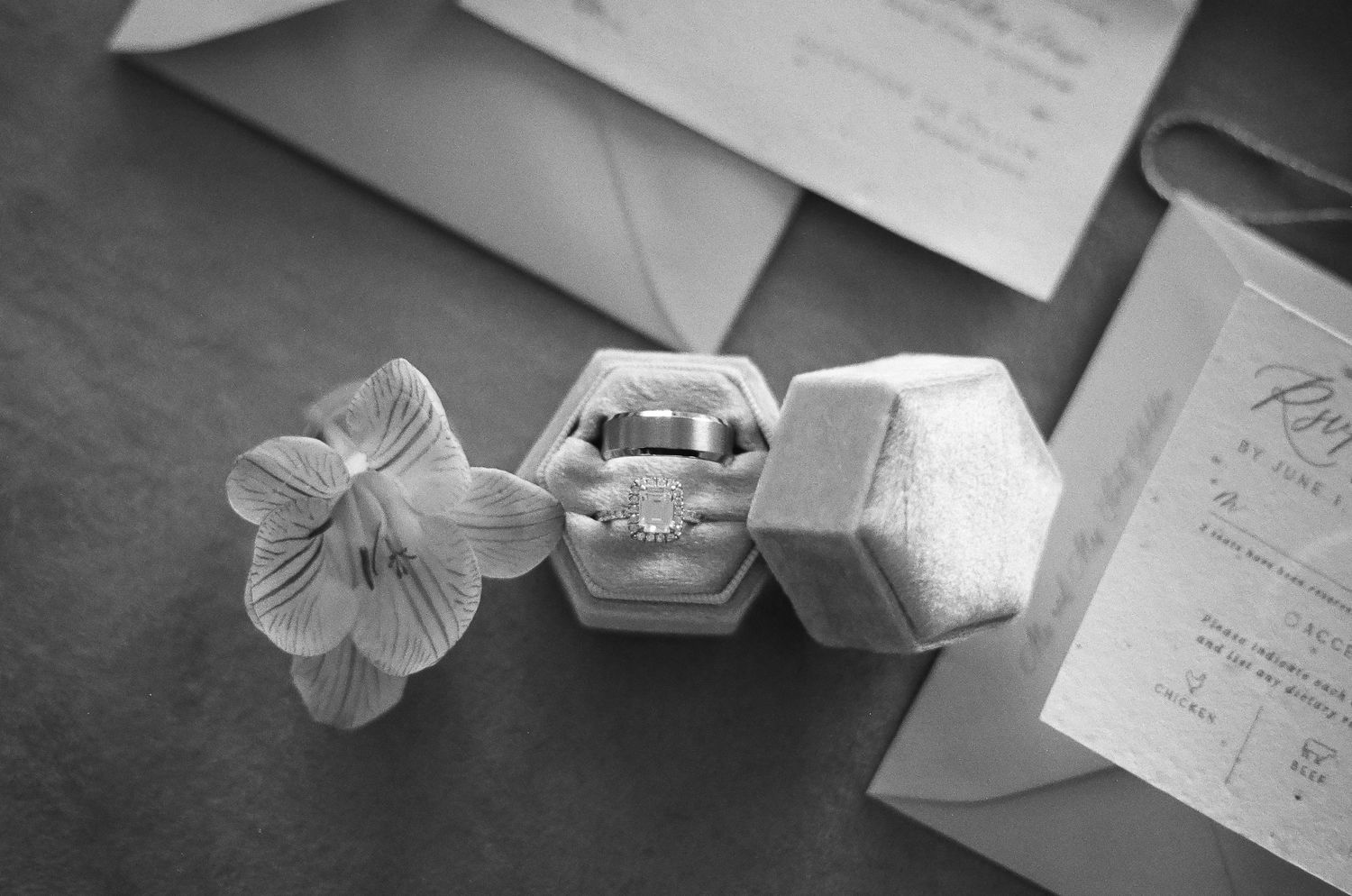 Wedding rings photographed on 35mm film with soft, nostalgic lighting