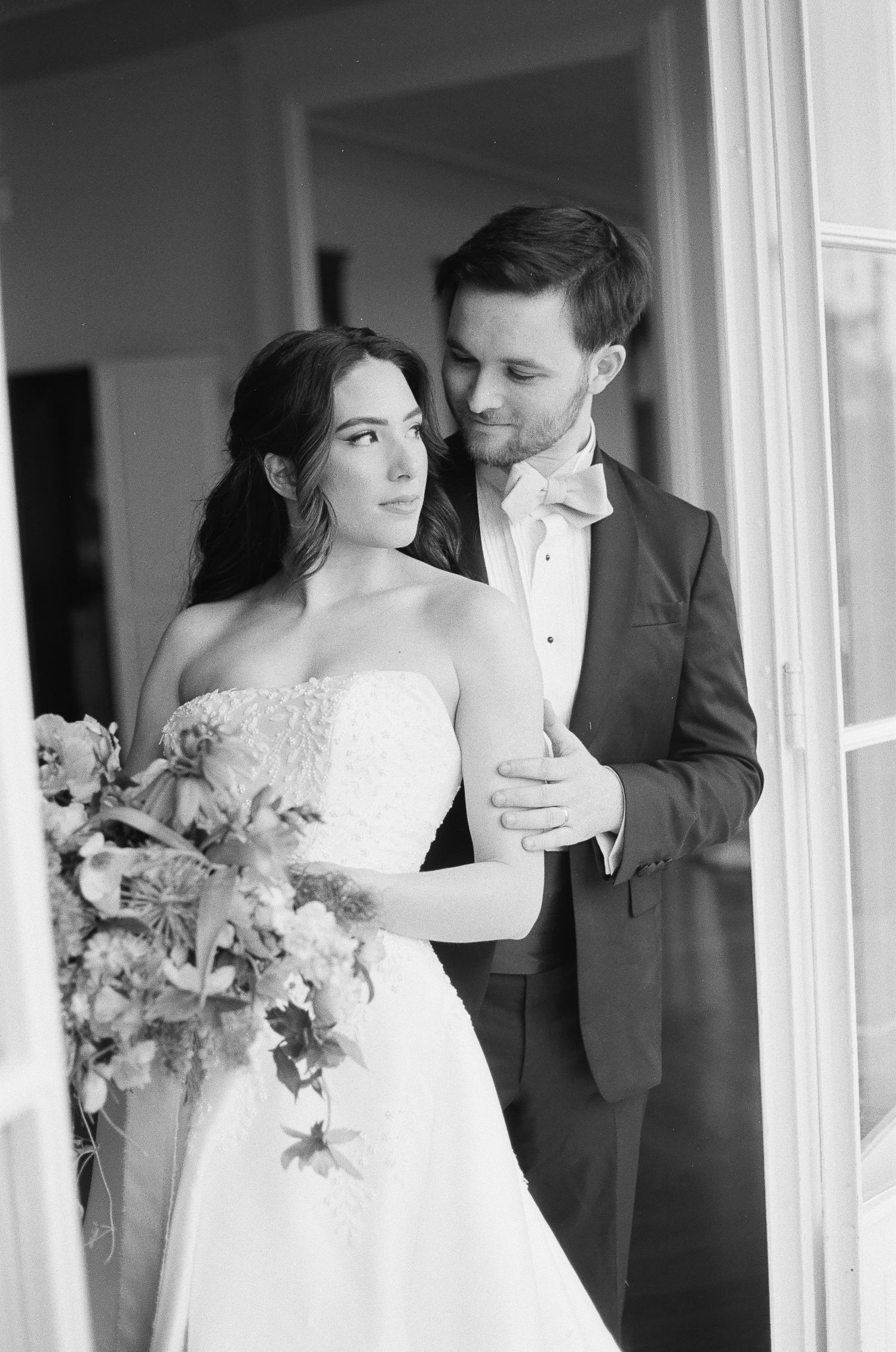 Bride and groom sharing a quiet moment captured on 35mm film