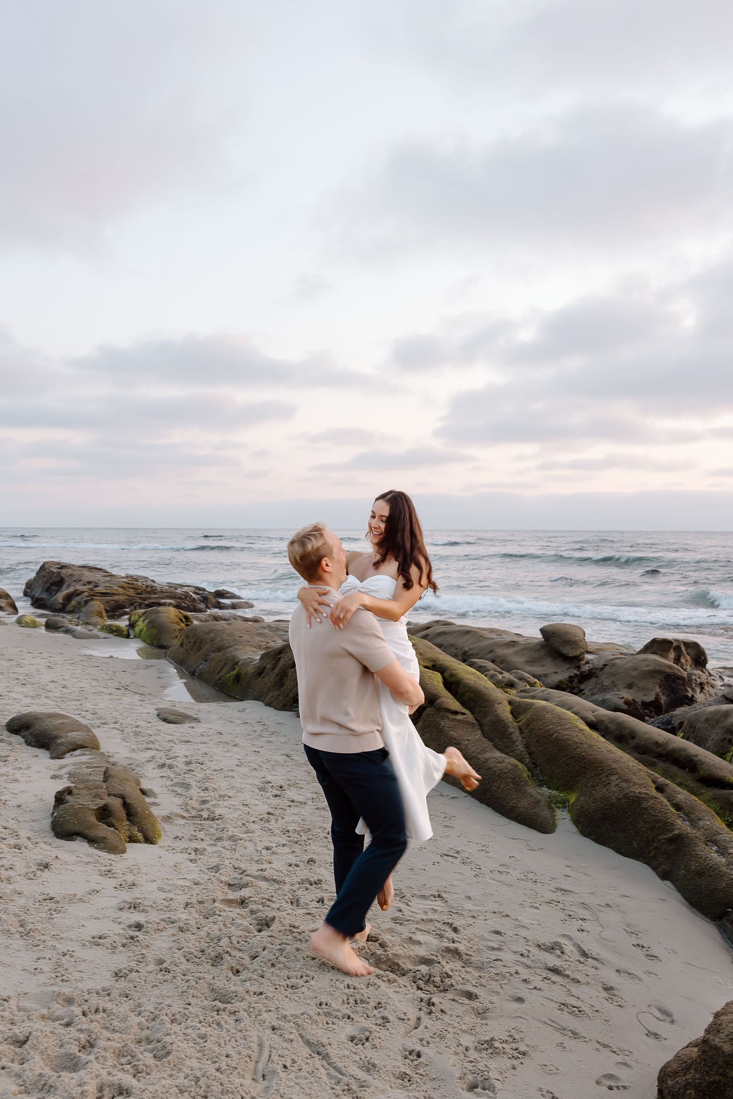 Candid beach photos at Kent Island’s Matapeake Beach with views of the Chesapeake Bay Bridge.