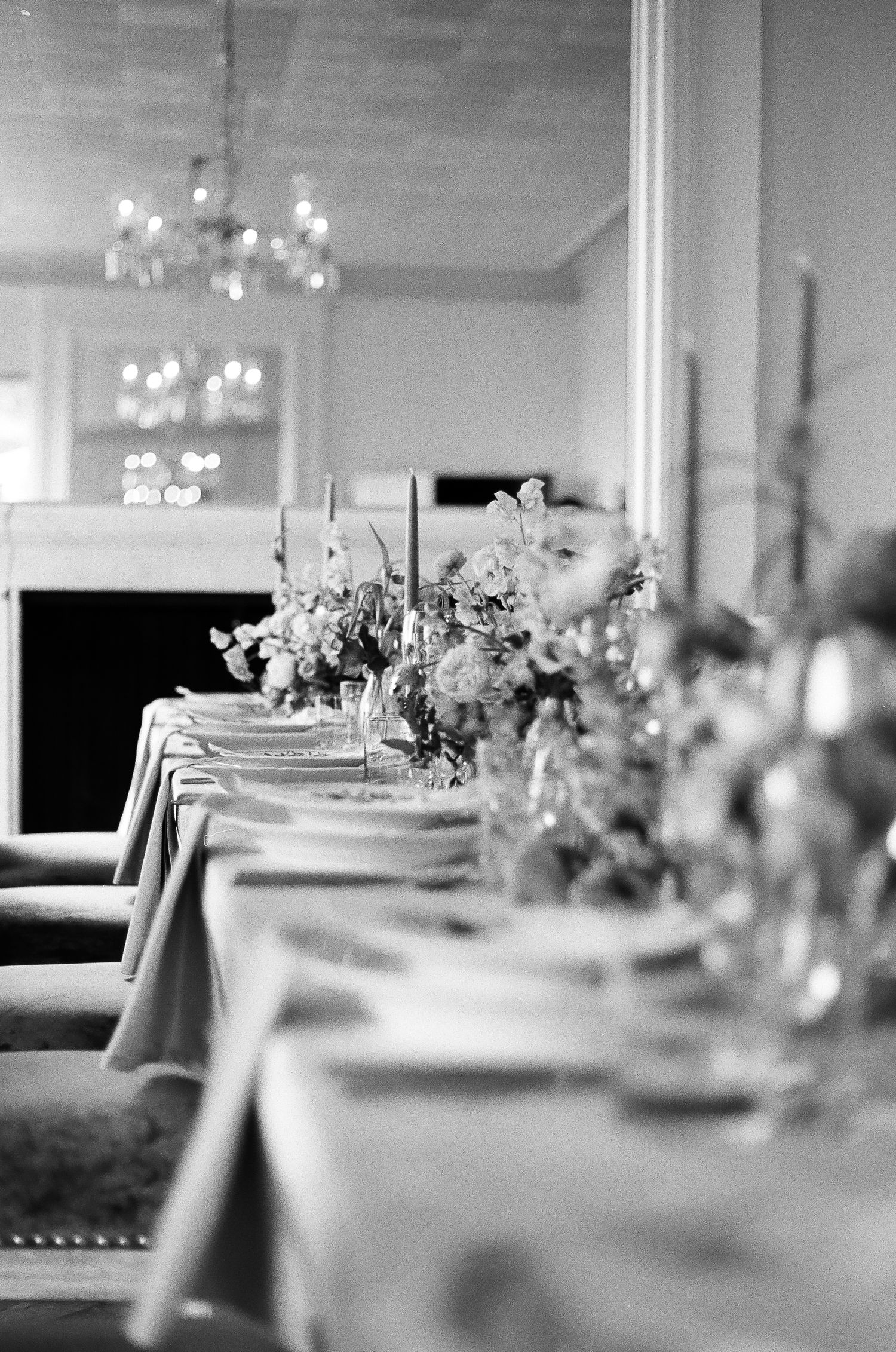 Candid reception moment shot on 35mm film with authentic lighting and texture