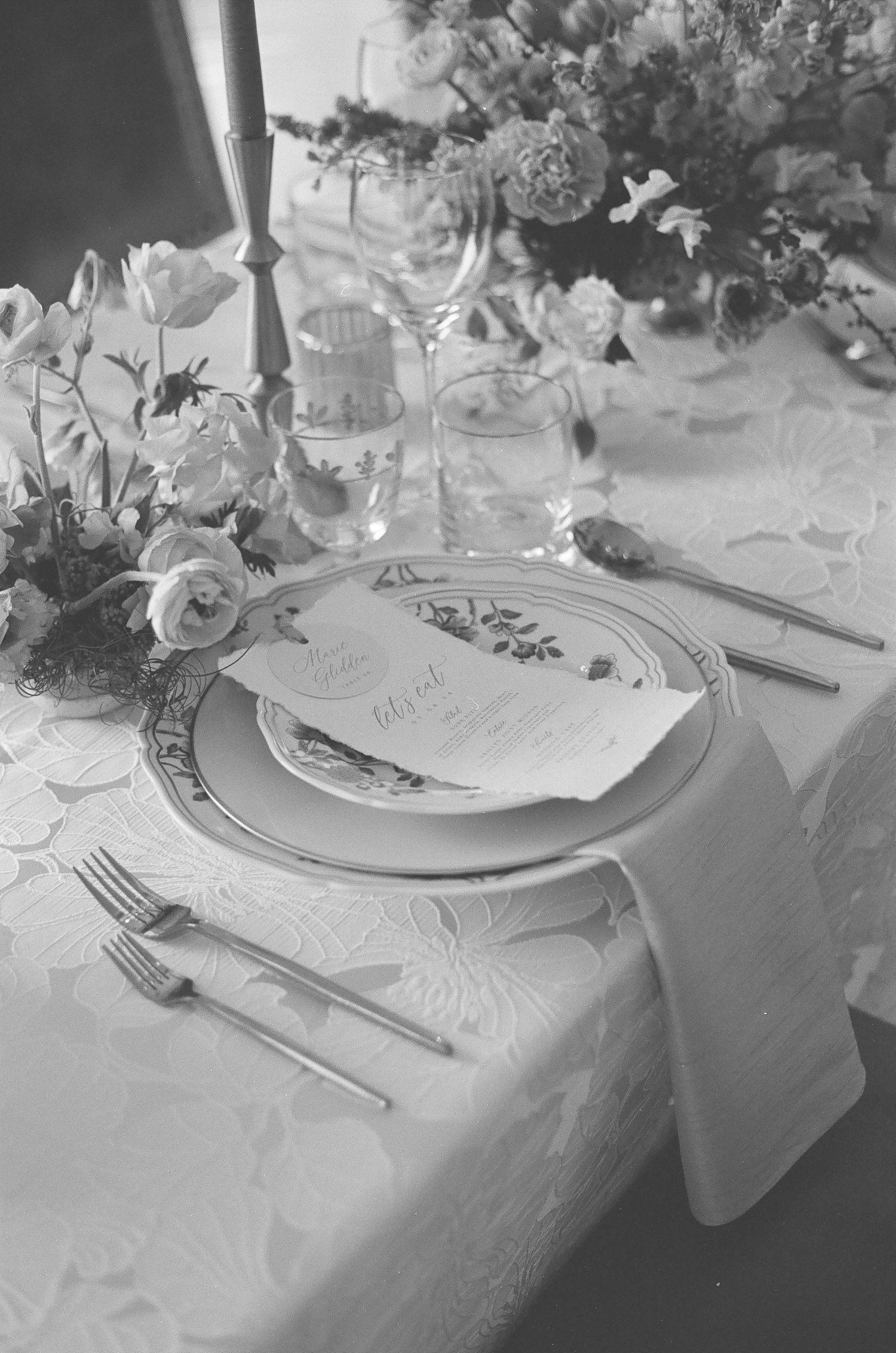 Candid reception moment shot on 35mm film with authentic lighting and texture