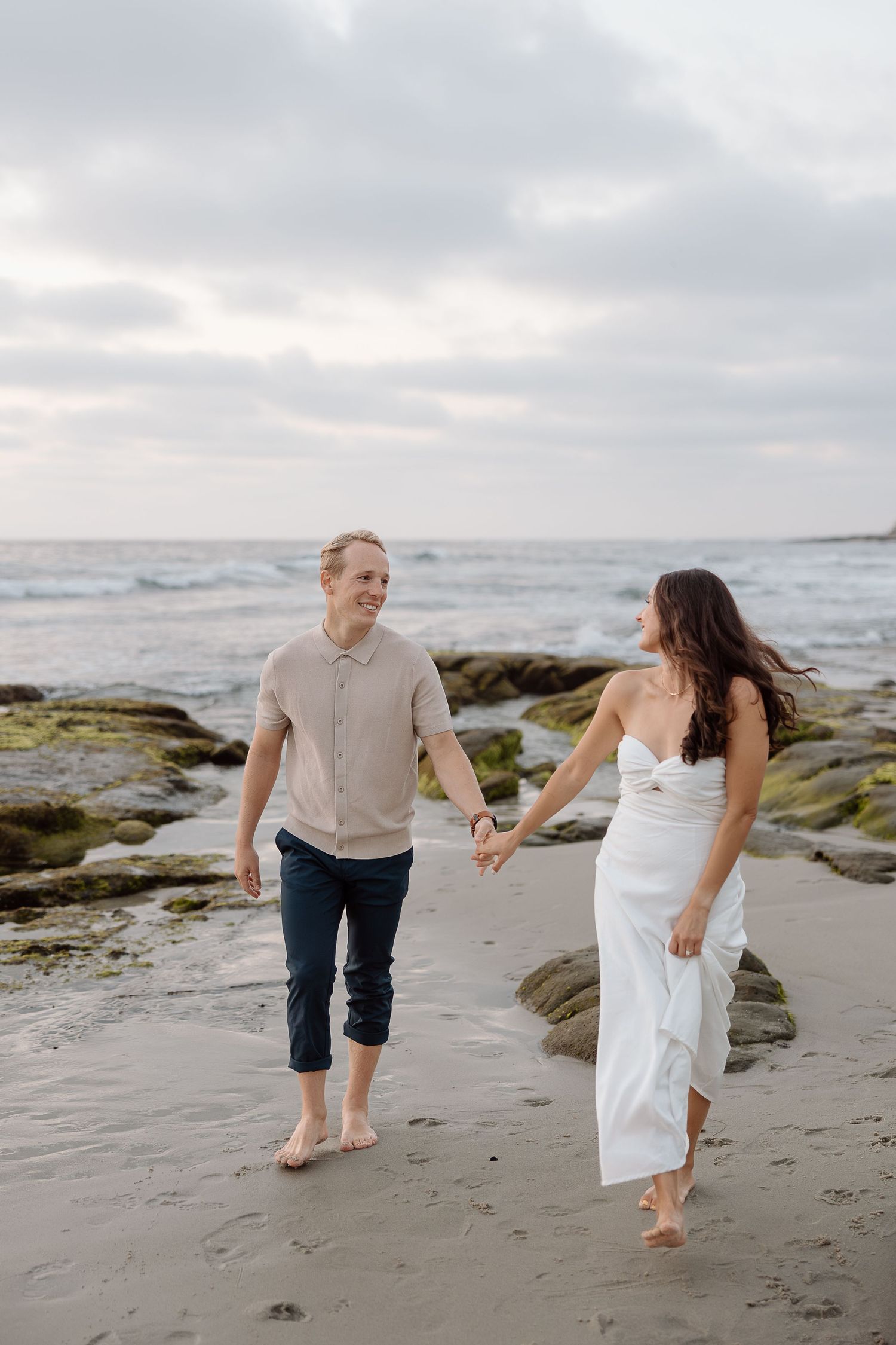 Candid couple standing by the water at Colonial Beach, Virginia during golden hour.