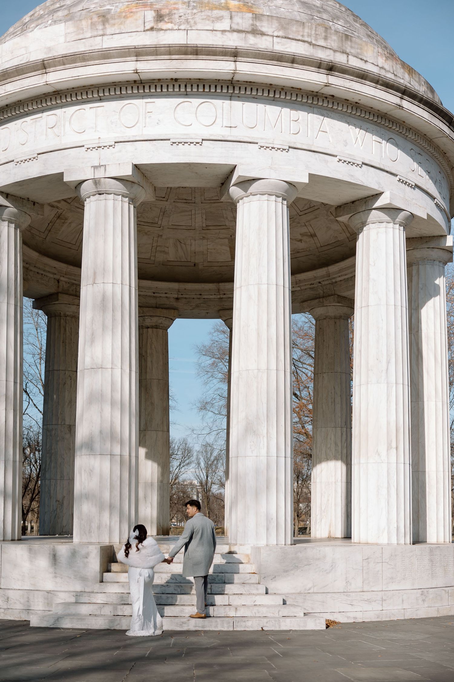 Candid newlywed portraits at the World War II Memorial during a Washington, DC elopement.”**