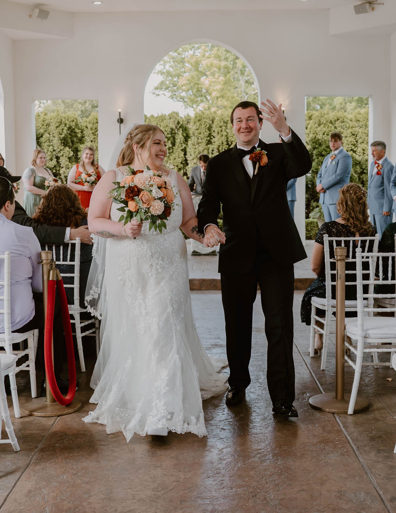 A wedding celebration sequence shows joyful dancing and movement on a covered outdoor patio with white columns.