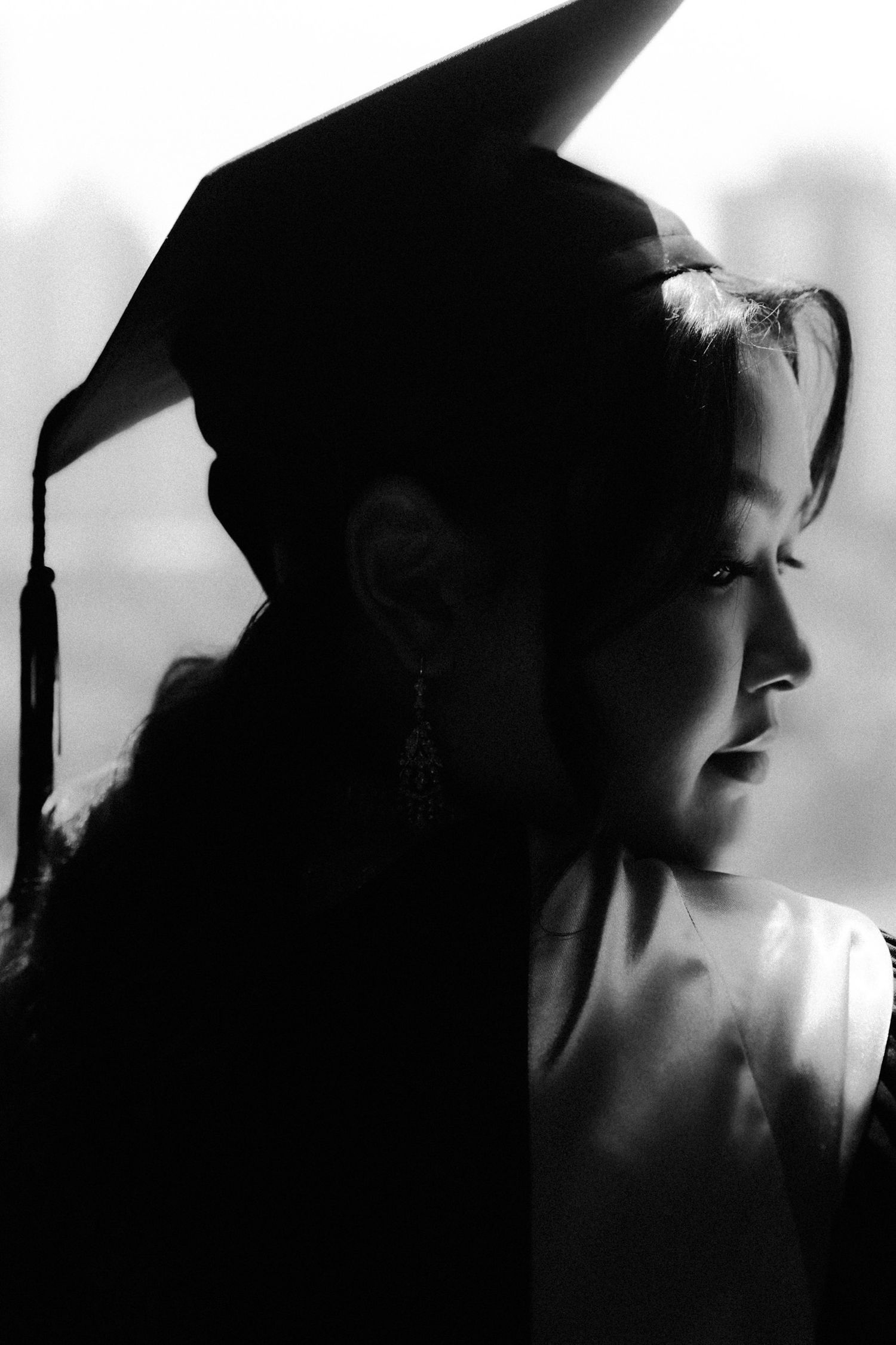A black and white artistic portrait series showing silhouetted figures in dramatic lighting and shadows.
