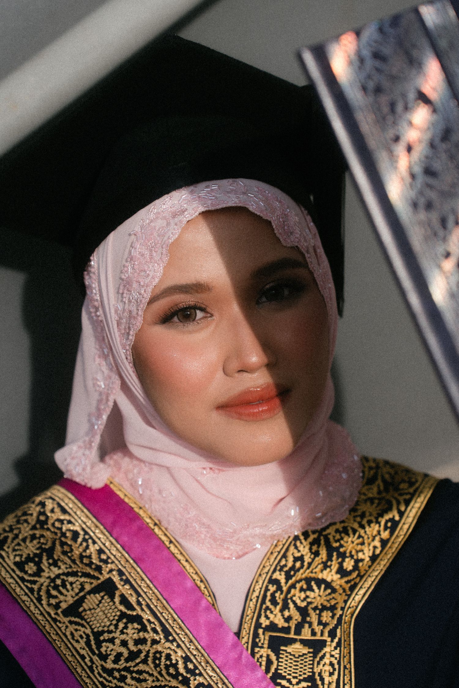 A sequence of close-up shots showing traditional Middle Eastern bridal attire with pink and gold embellishments.
