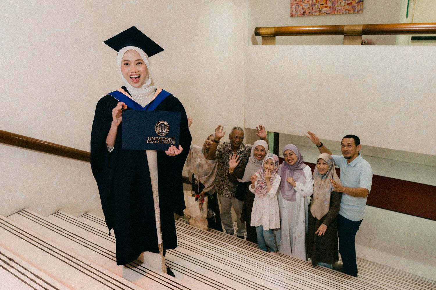 A sequence of graduation ceremony photos showing people in black caps and gowns walking across a stage.