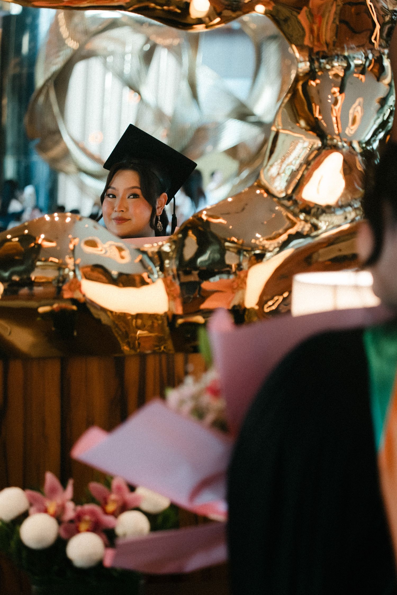 Decorative glass ornaments and pink elements create a dreamy atmosphere with twinkling lights.