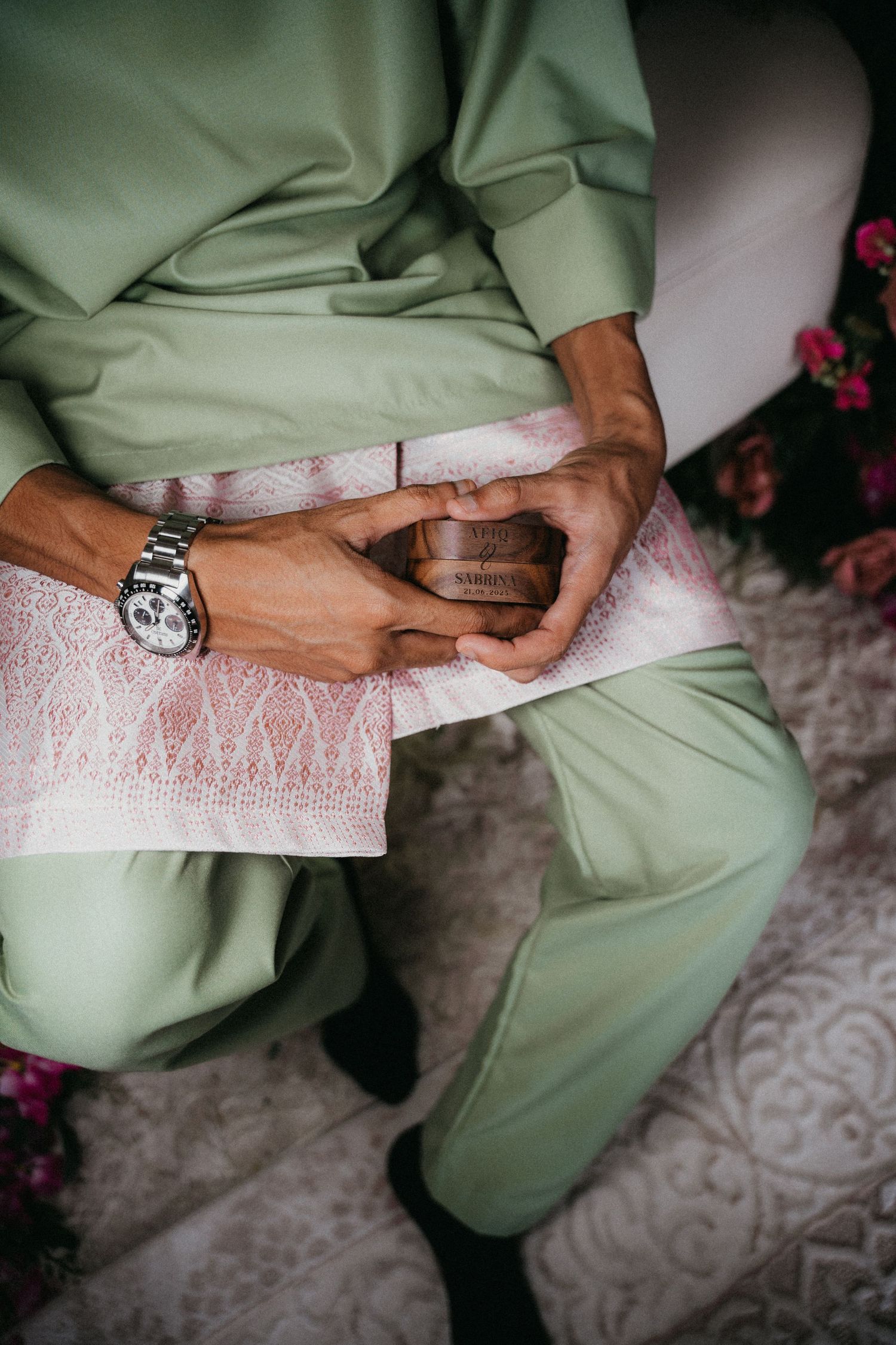 A series of detail shots showing hands wearing a watch and light green clothing against lace fabric.
