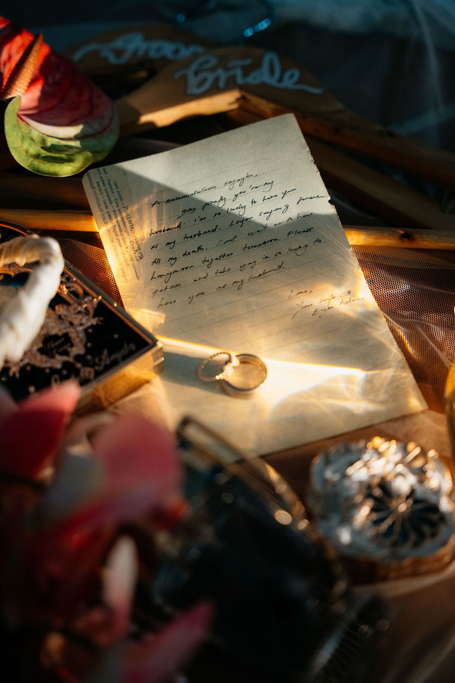 A series of photographs showing handwritten notes in dim lighting with blurred backgrounds and dramatic shadows.