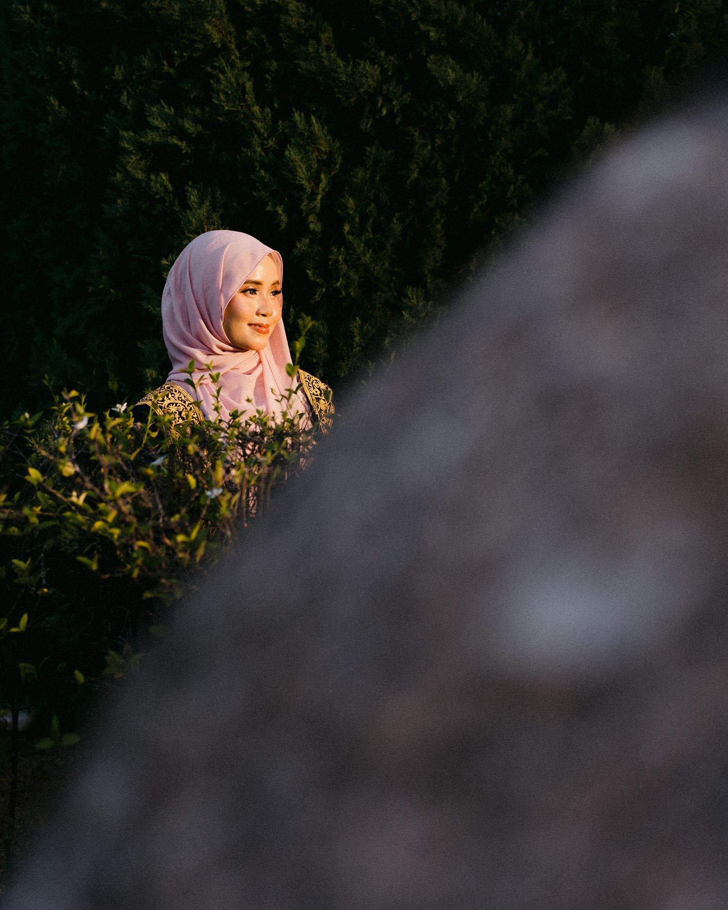 A series of moody outdoor portrait photographs with dark foliage background and dramatic lighting.