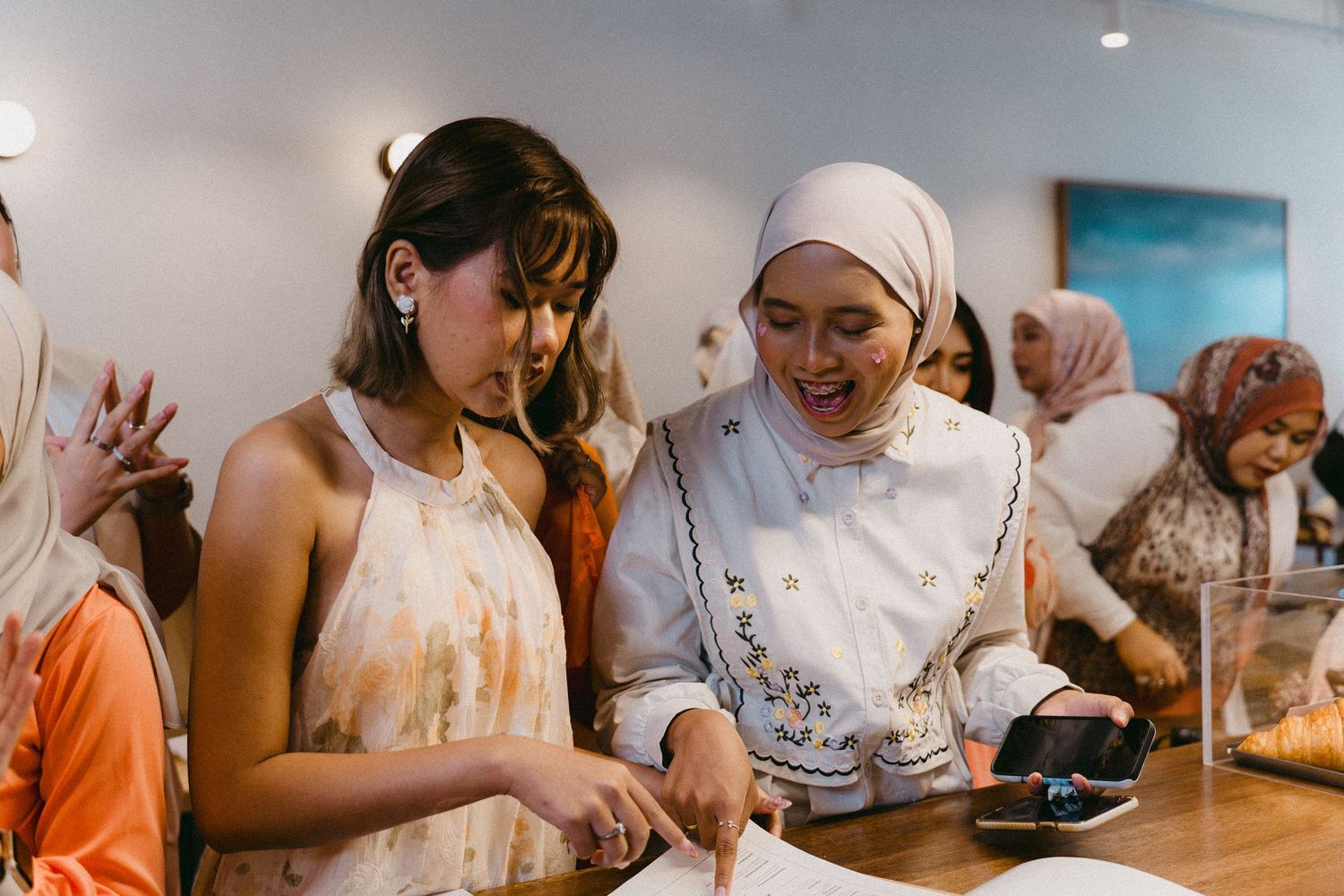 Two people cooking together and sharing a joyful moment in the kitchen.