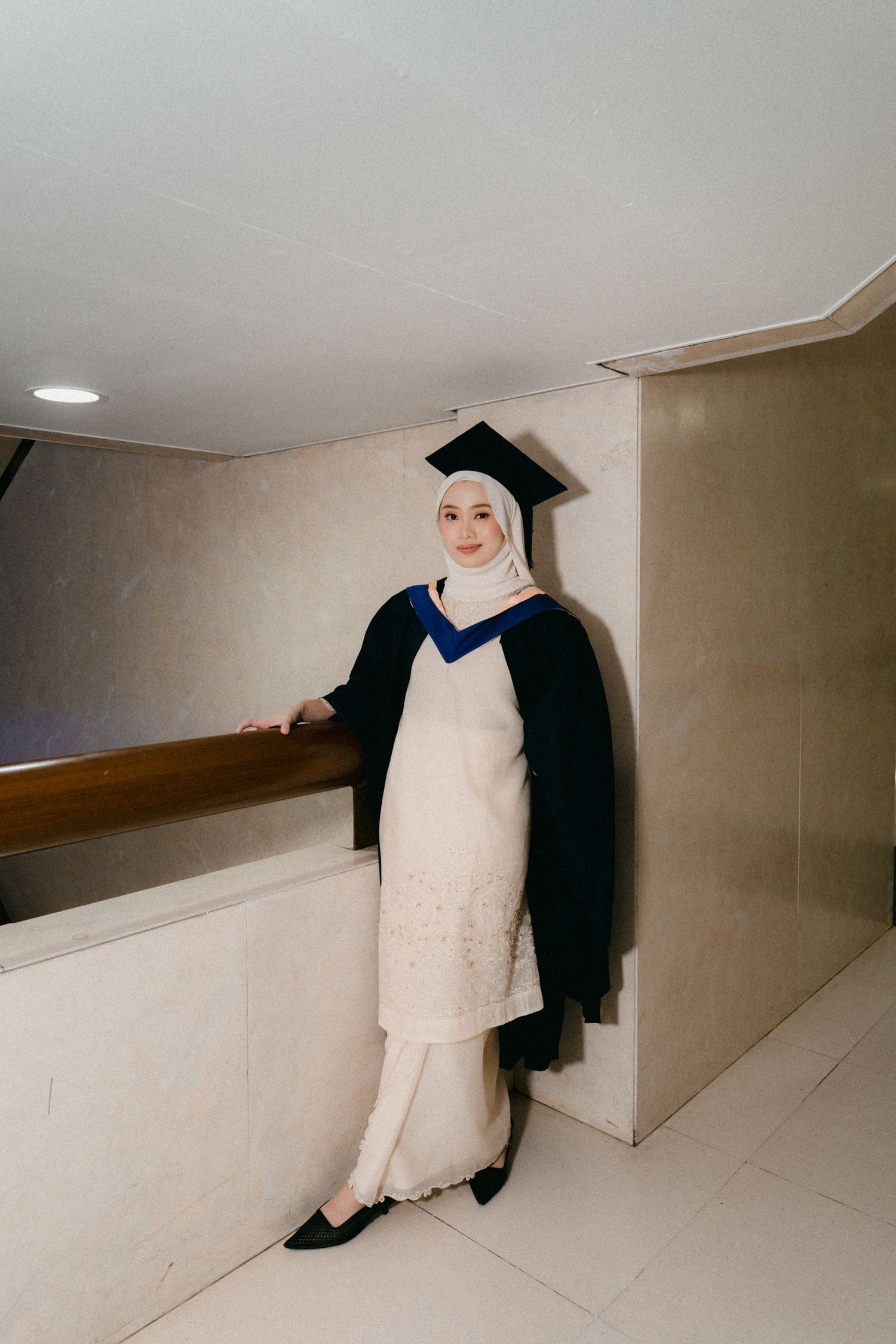 A figure in white and black attire poses against minimalist architectural corners in a sequence of artistic shots.