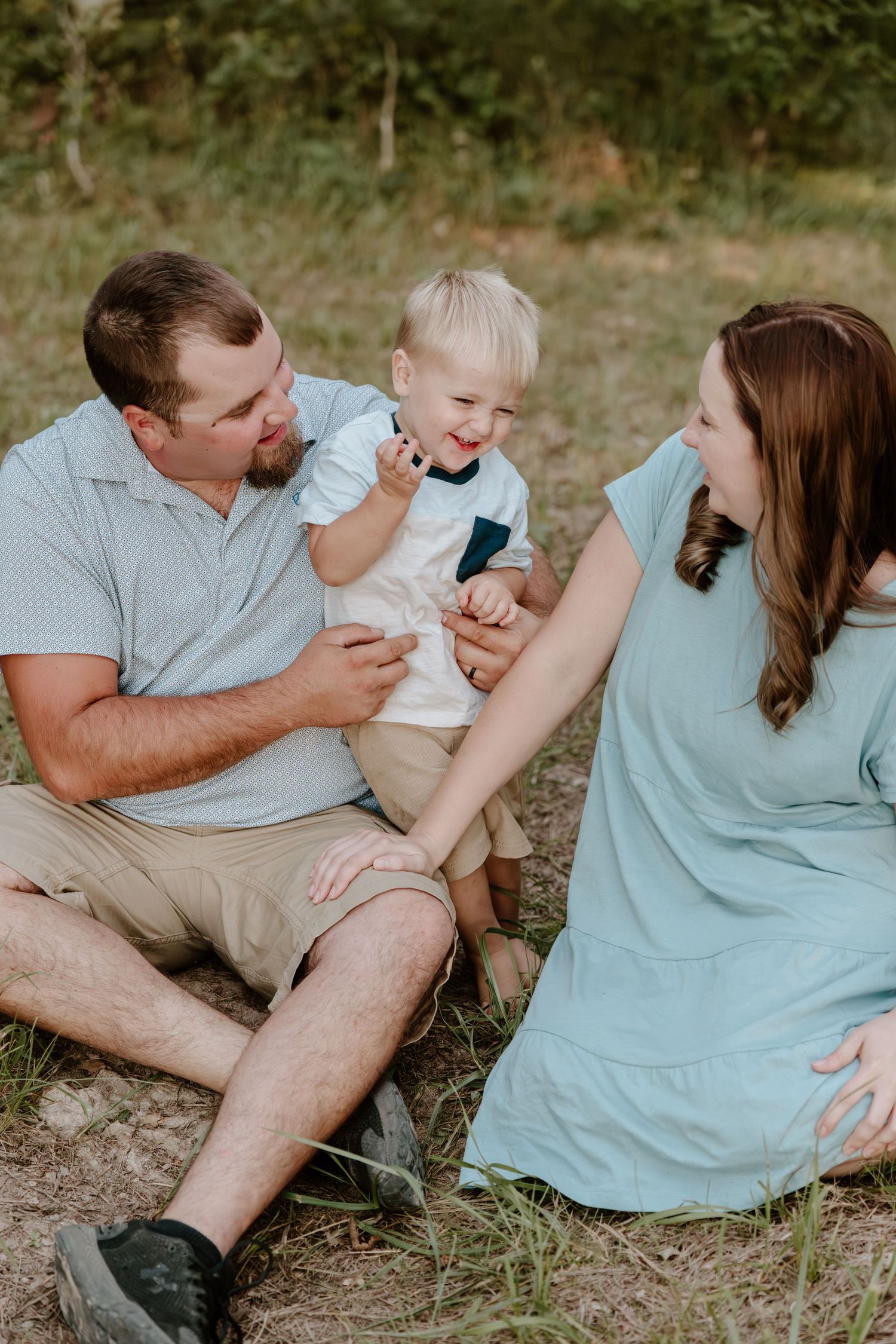 A series of candid outdoor photos showing people sitting together on grass in matching light blue and beige outfits.