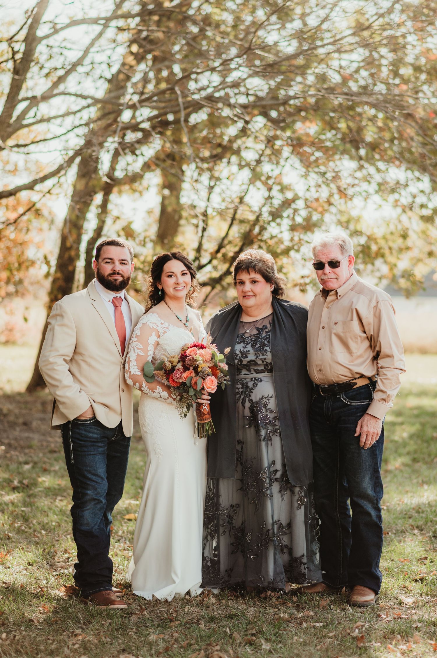 Lauren with her new husband and inlaws at their wedding