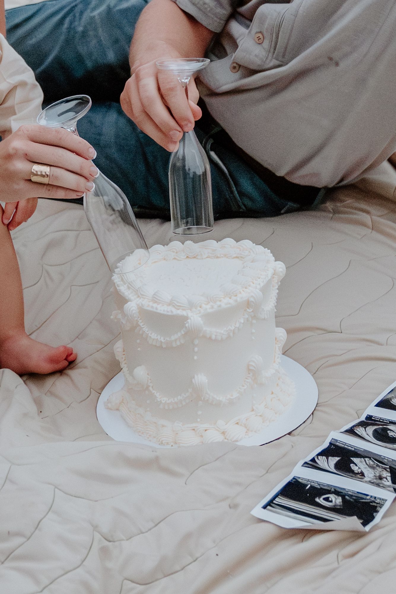 A series of photos showing hands decorating a white frosted cake with delicate pearl-like piping details.
