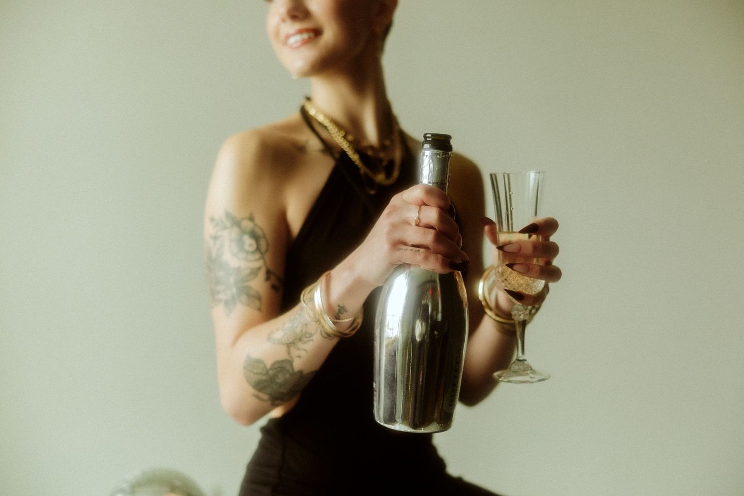 girl holding bottle and champagne glass