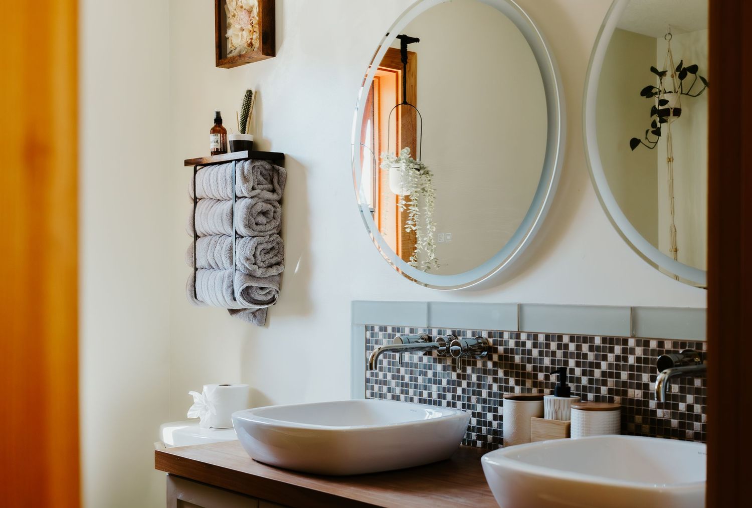 bathroom mirrors an towels arranged nicely