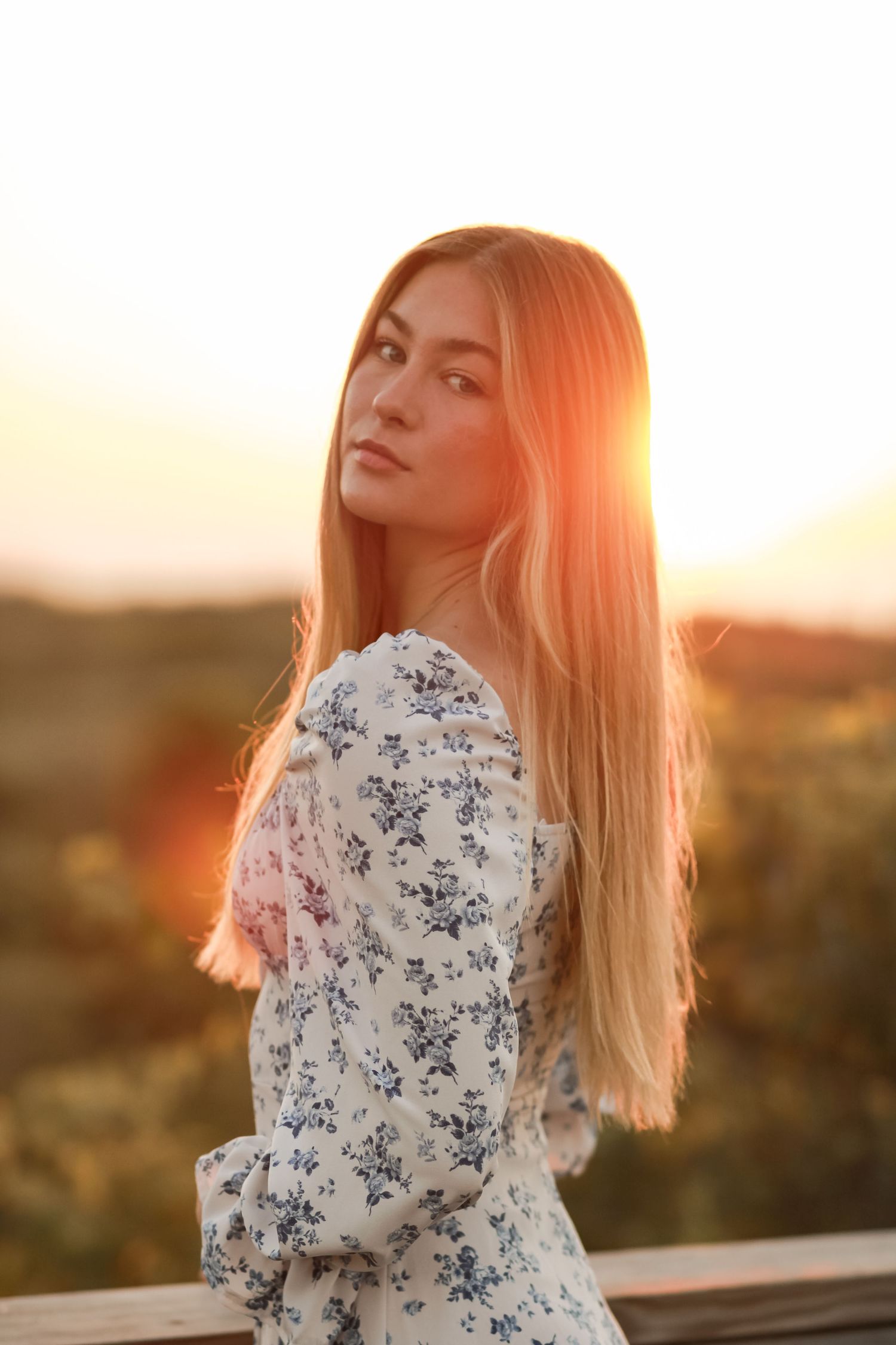 A sequence of sunset portraits in a floral dress with golden hour lighting.
