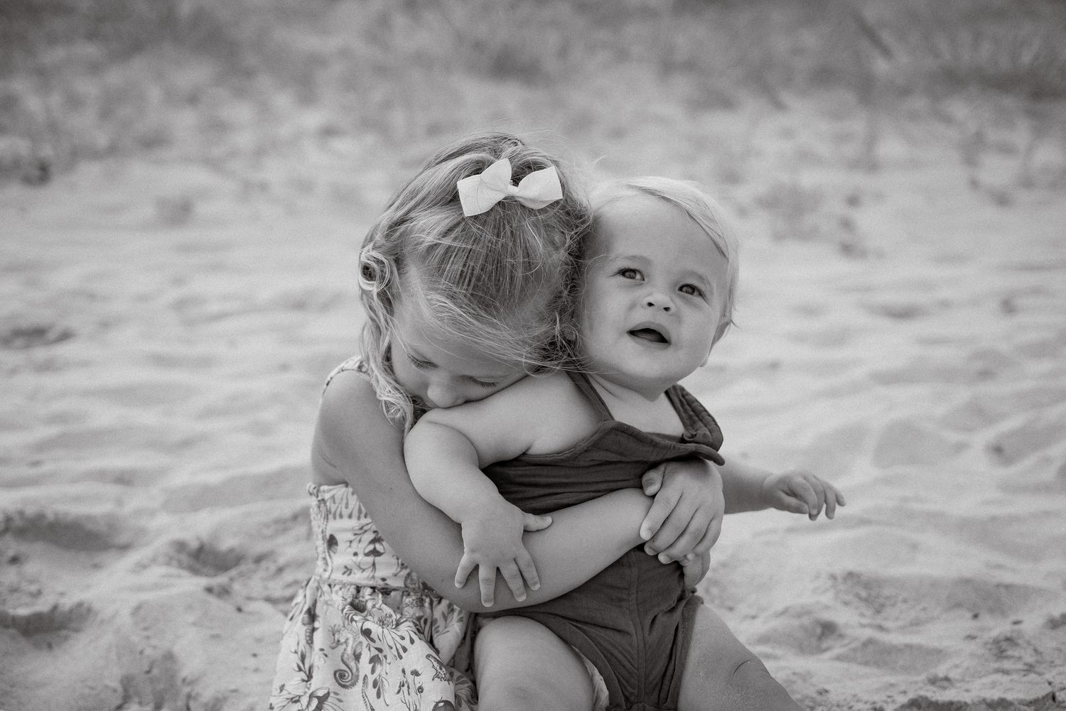 A series of playful candid moments captured at the beach with soft lighting and natural expressions.