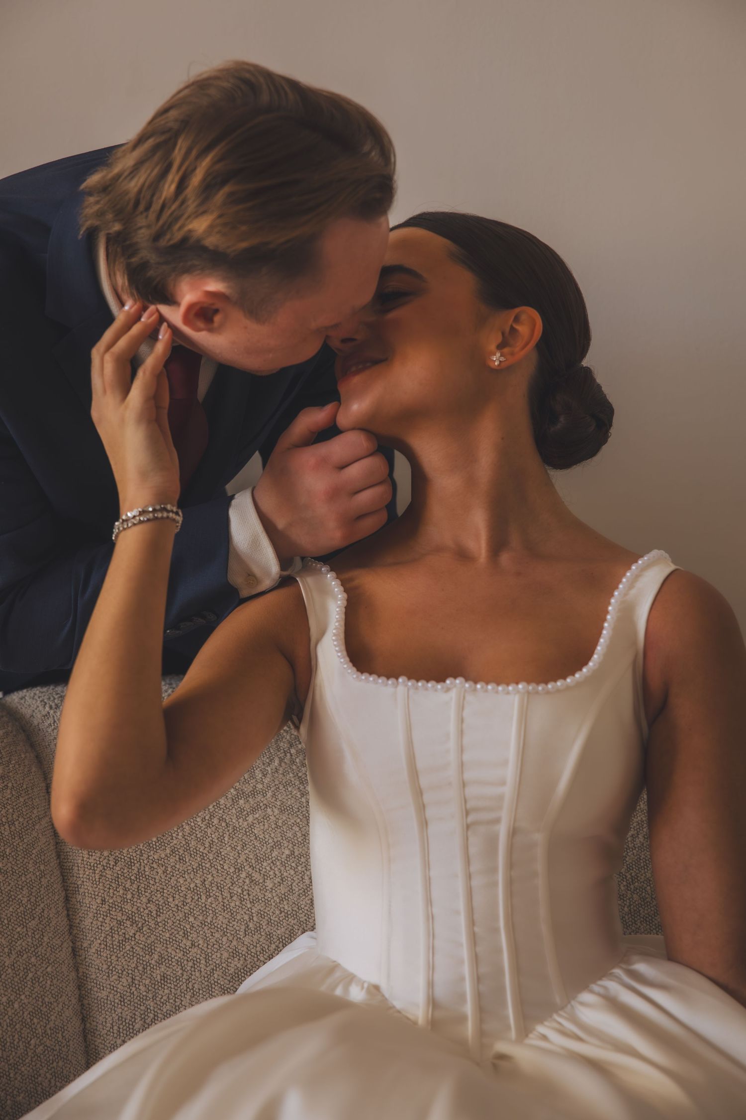 An intimate moment between newlyweds sharing a tender moment.