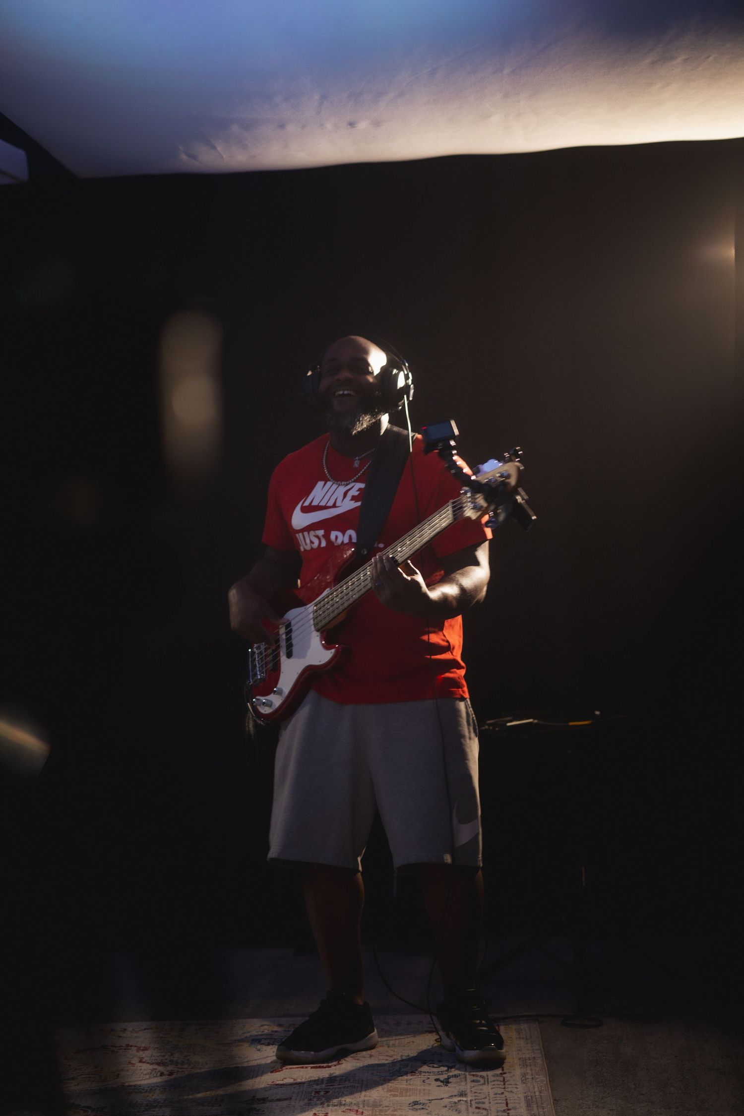 Hip hop dancers perform dynamic moves in low-light conditions on stage during a dramatic dance performance.
