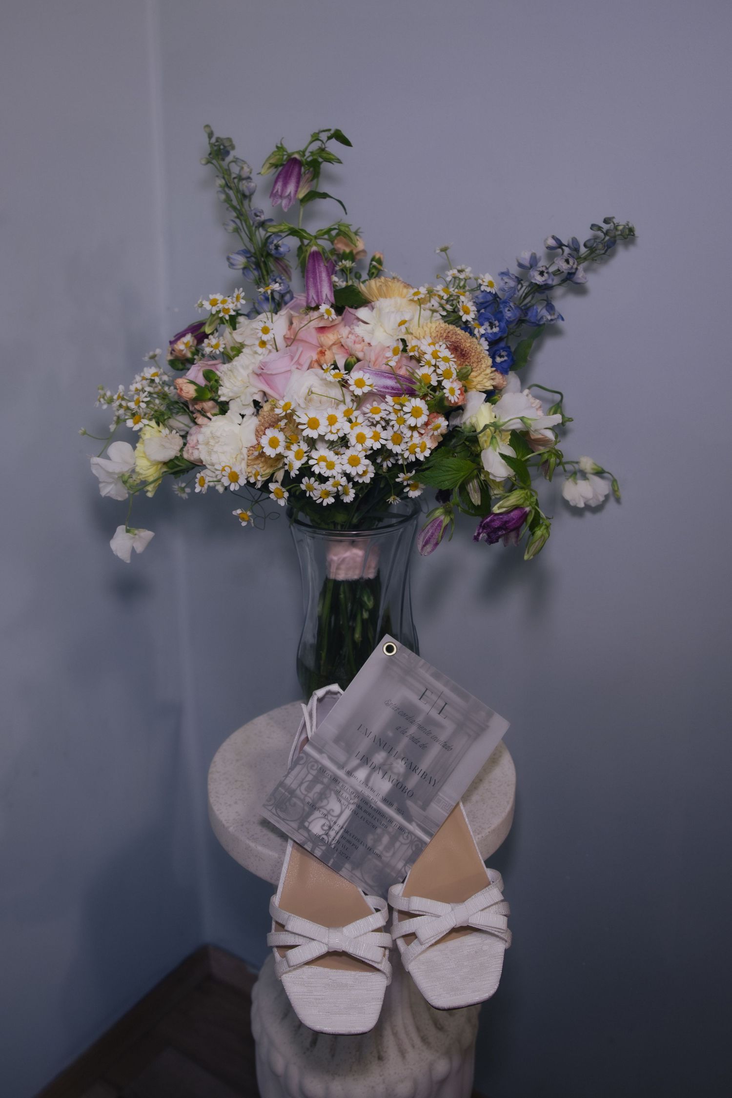 A progression of images showing a floral arrangement with colorful blooms displayed in a white pot with a bow decoration.