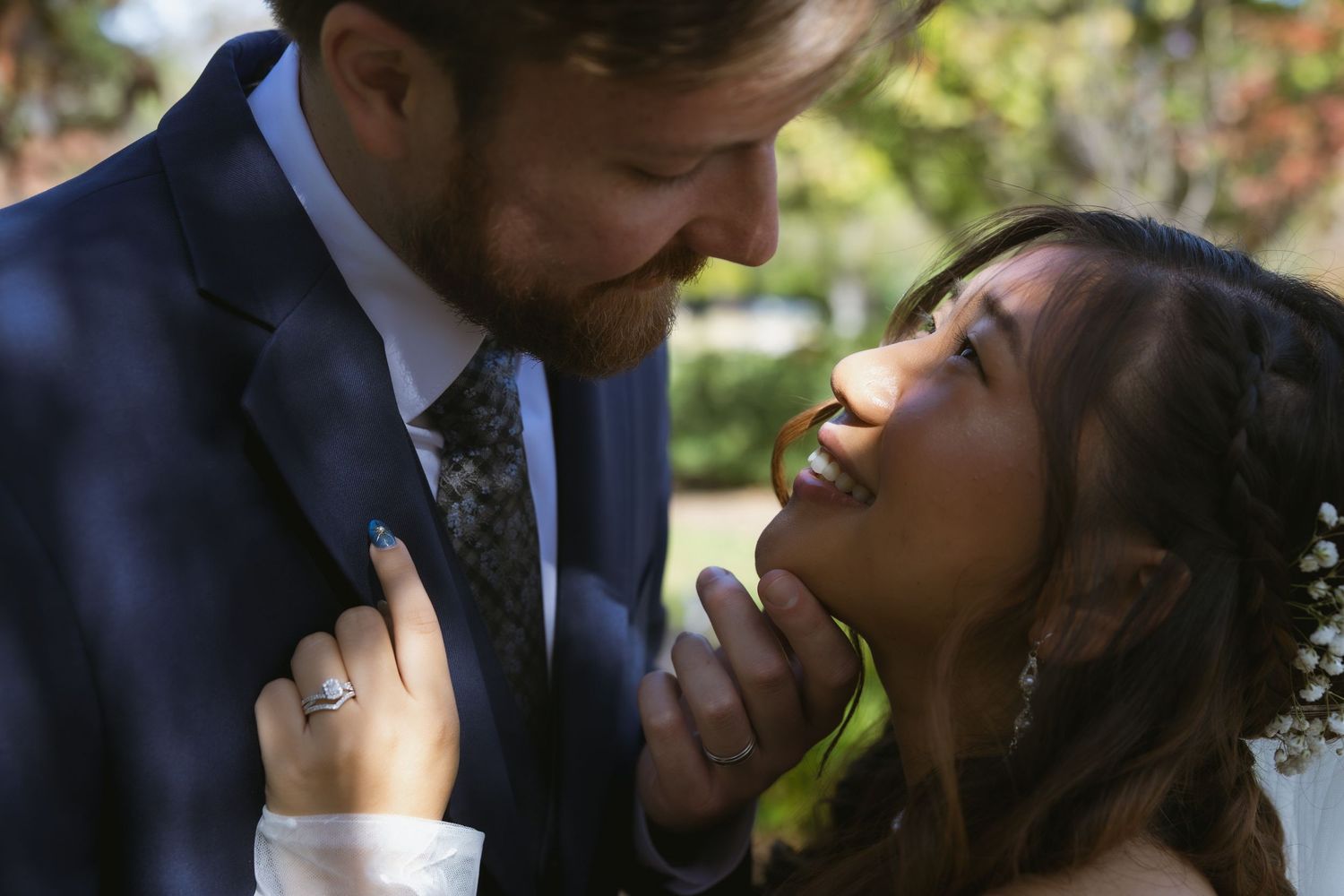 Romantic couple sharing tender kisses in a series of intimate outdoor wedding photos.