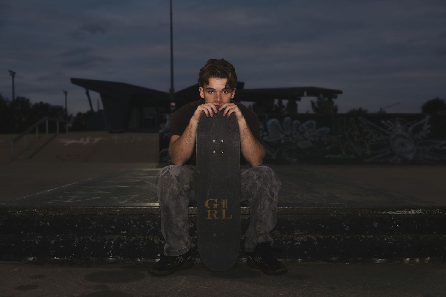 A sequence of dark moody photographs showing someone in silhouette against evening skies.