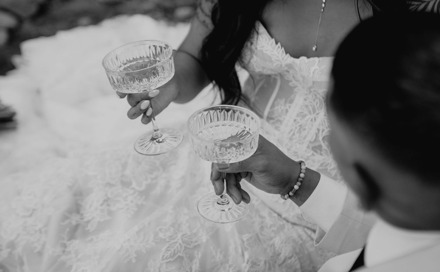 Crystal champagne glasses sparkle in elegant wedding table settings in Alaska