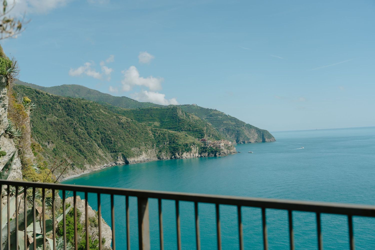 Stunning coastal view of Cinque Terre's dramatic cliffs and turquoise waters.