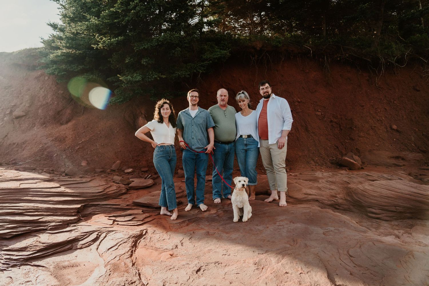 Group photo session at a scenic red rock formation location.