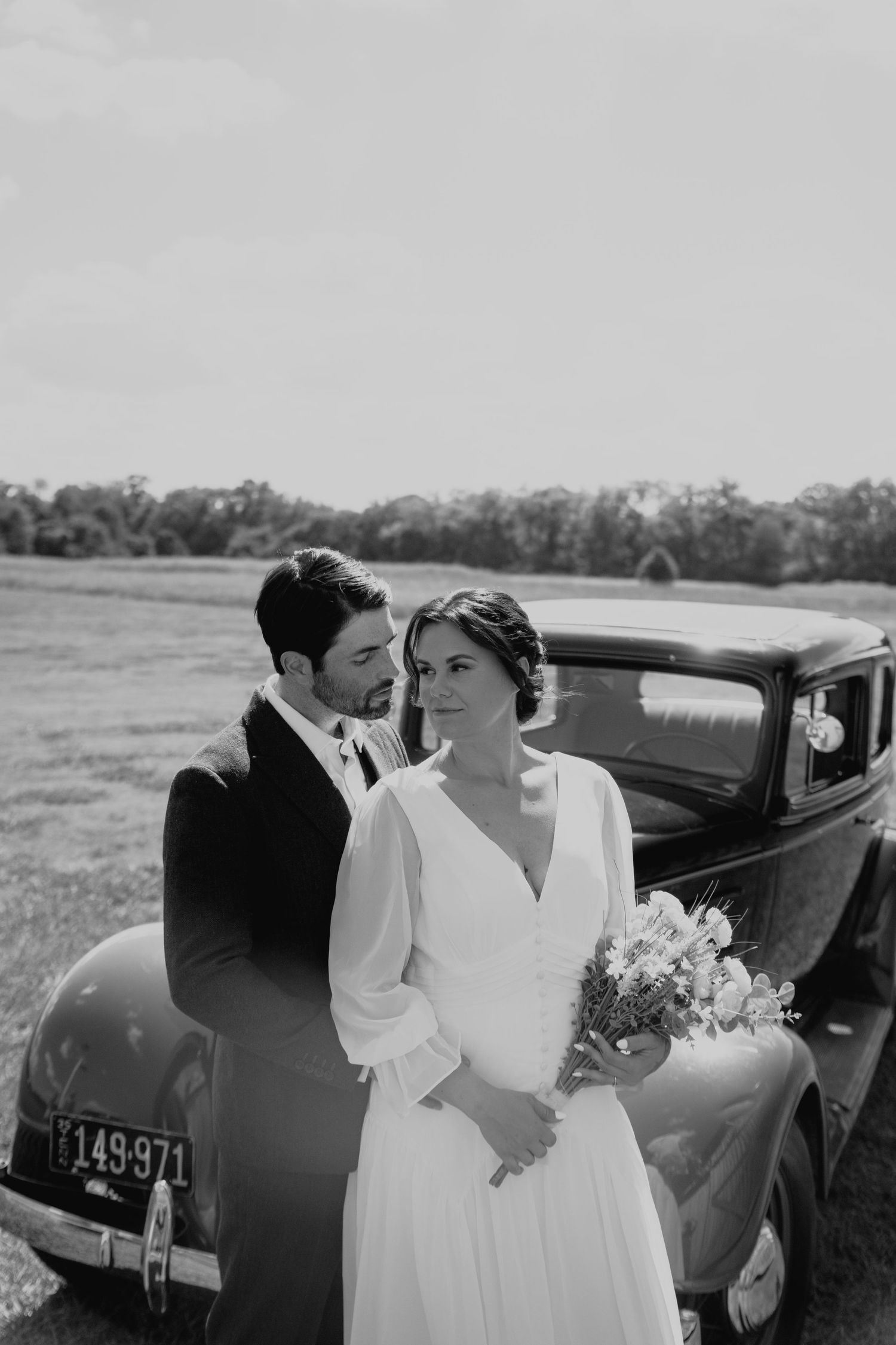 Vintage wedding scene with classic car in black and white photography in Nashville, Tennessee